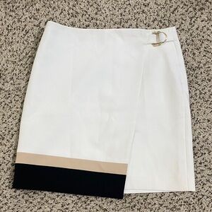 White House Black Market skirt with black & nude stripe & gold buckle detail